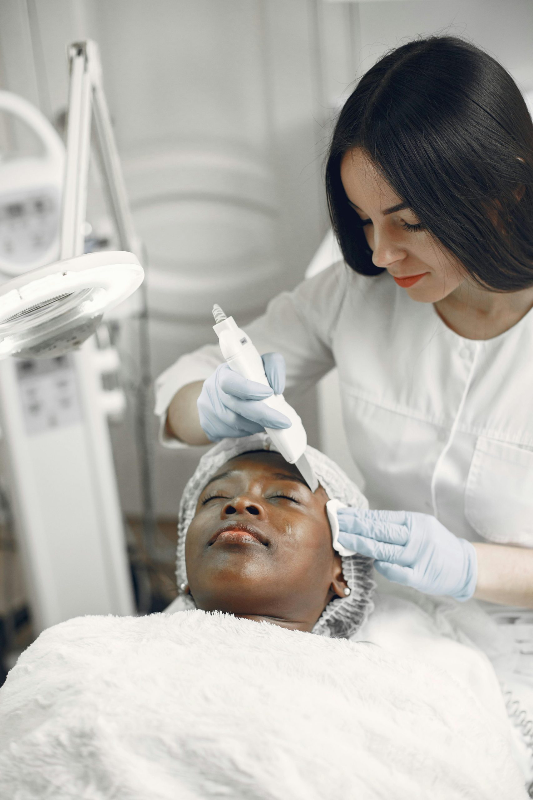 Woman receiving a soothing facial treatment at a spa for ultimate relaxation and skincare.